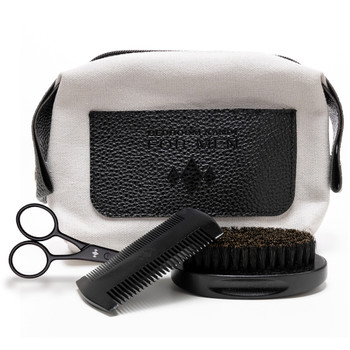 An image of the BK for Men grooming kit for Bedroom Kandi gentleman arranged on a white background. The kit contains a bag and brush, comb and scissors.