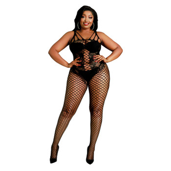 A front view of a curvy model wearing a fishnet body stocking