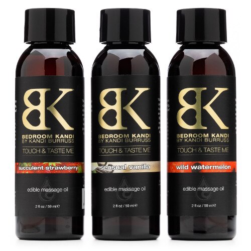 An image of three 2oz bottles of Edible Massage Oil on a white background, in strawberry, vanilla, and watermelon flavors.