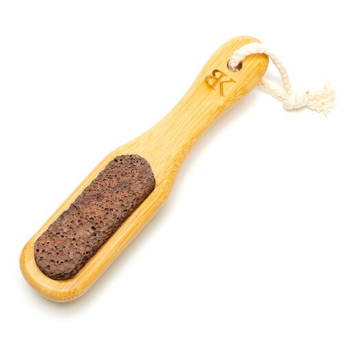 The pumice stone side of the Bedroom Kandi foot fetish brush for exfoliating your feet