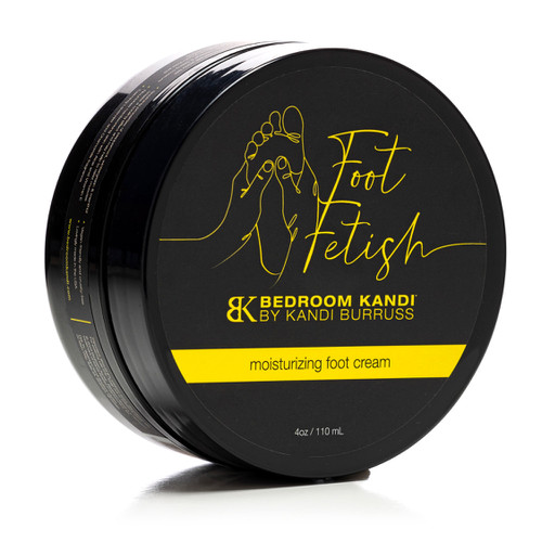 A closed black jar of Foot Fetish Moisturizing Foot Cream by Bedroom Kandi on its side on a white background.