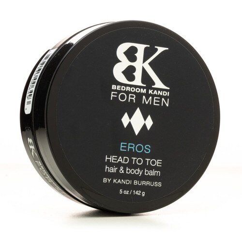 An image of a round black jar of BK for Men's Head to Toe hair and body balm balanced on its side on a white background