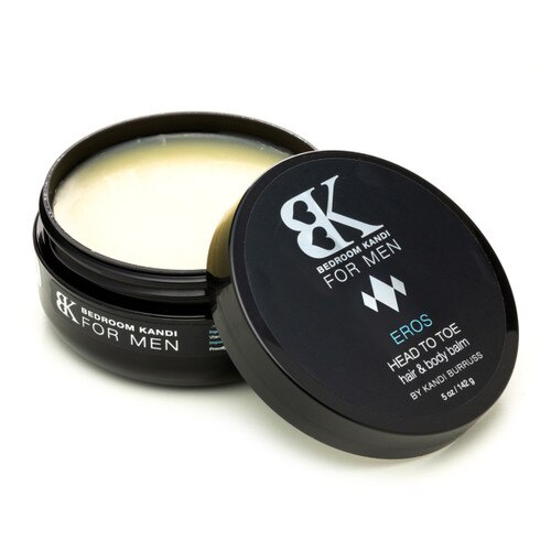 An image of an open round jar of BK for Men Head to Toe balm, the lid to one side, the pale yellow unblemished surface of the balm visible within.