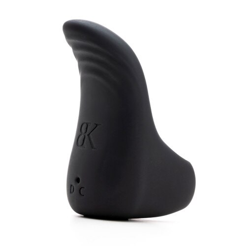 A side view of the black GET IN TOUCH vibrator standing on a white background. The side of the vibrator is gently ridged for added sensation, above an embossed BK logo and the charging port.