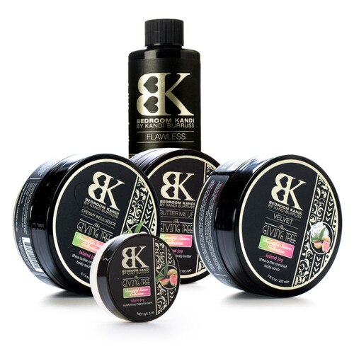 An image of the wash, scrub, butter, soufflé, and balm within the Giving Tree Collection, all in the Island joy scent. The products are clustered together on a white background.