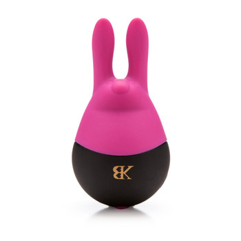 An image of the Hip Hop clitoral massager standing upright on a white background. It is pink and black and shaped like an egg with two rabbit ears and a small stylized rabbit face.