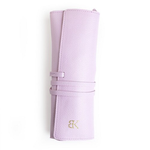 A cylindrical pale pink faux-leather carrying case with the BK logo in gold. The roll-up case makes it easy to store the Horizons dilators.