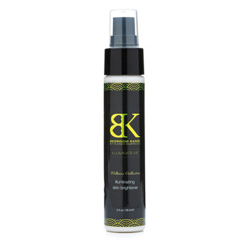 An image of Illuminate Me skin brightener on a white background. It comes in a tall, narrow pump bottle with a black cap. The label has the Wellness Collection branding.