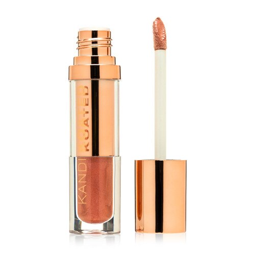 An open container of Liquid Satin “Alluring”, a shimmering warm rose gold. The rose gold cap with doe foot applicator stands beside it on a white background.