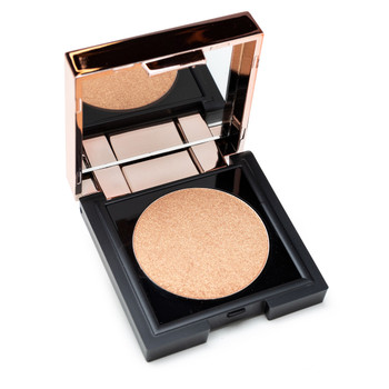 A small square black and rose gold compact with a mirrored inner lid is open to reveal a round of illuminating powder in "Climax", a shimmering light warm gold.