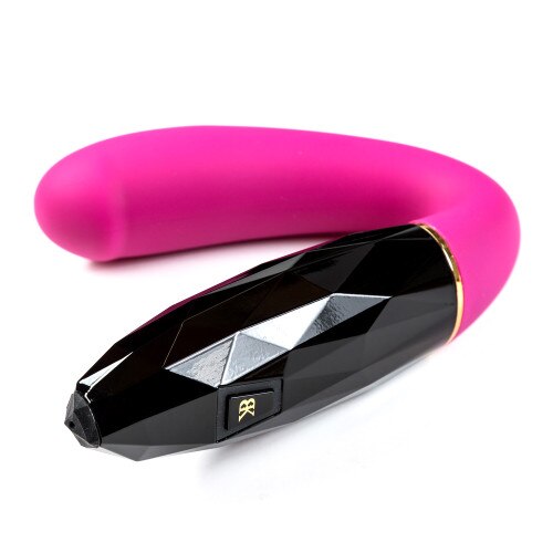 An angled view of Allure lying on a white background, with the handle in the foreground. Both the control button on the side and the charging port on the end of the handle are visible.