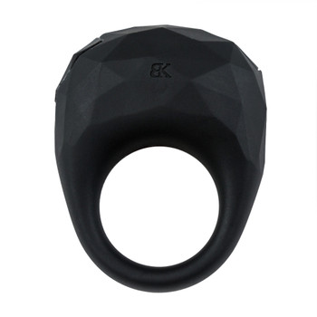 An image of the Luxe Embrace couples ring. It is a black silicone vibrating ring with a diamond pattern on a white background.