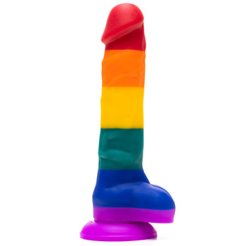 Side view of the upright NEXT LEVEL rainbow dildo standing on its base on a white background