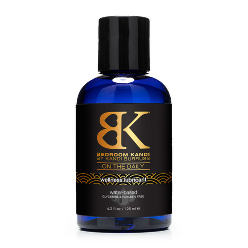A blue plastic 4.2oz bottle of On the Daily lubricant with a black cap and black and gold label with the Wellness Collection design.