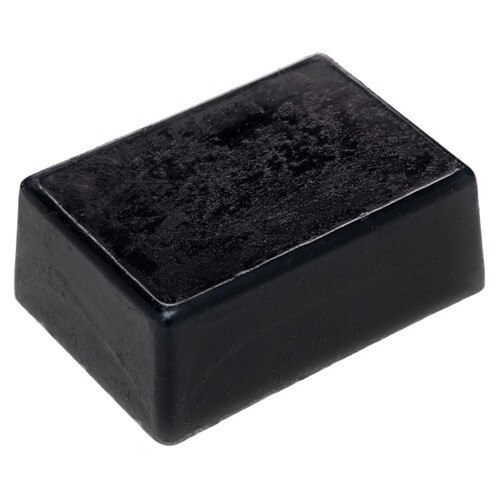 Pure activated charcoal face and body bar for cleansing skin, a black soap bar