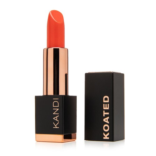 An image of a black and rose gold Satin lipstick tube with the cap beside it. The tube reads Kandi and the cap reads Koated. The color is Heartbreaker, a vivid creamy reddish orange.