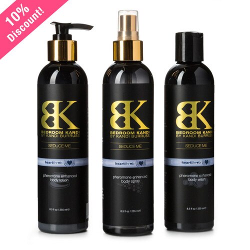 An image of three round-topped bottles of Seduce Me lotion, mist, and body wash in Heartthrob fragrance on a white background.