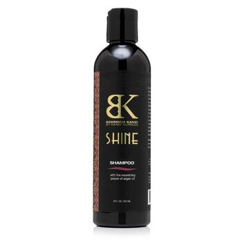 A black round-topped bottle of Bedroom Kandi's argan oil-infused Shine shampoo