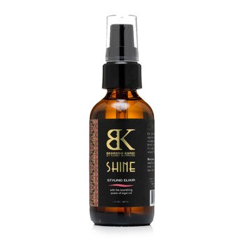 A brown glass pump-capped bottle of Bedroom Kandi's Shine hair styling elixir