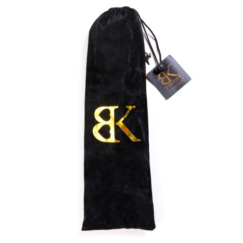 An image of a black velvet bag with golden BK printed on it that contains the SPREAD DESIRE bar segments for easy storage and travel.