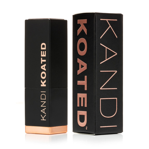 A closed black and rose gold tube of Kandi Koated Suede lipstick with the black and rose gold box beside it.