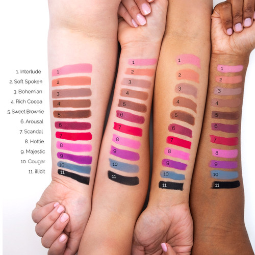 An image of four outstretched arms of differing skin tones showcasing 11 different colors of Suede lipstick in swatches on each arm for comparison.
