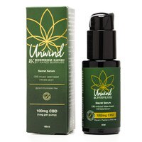 An image of our Unwind Lubricant pump-bottle beside the box that it is packaged in. The label is green and gold with Bedroom Kandi's Unwind design.