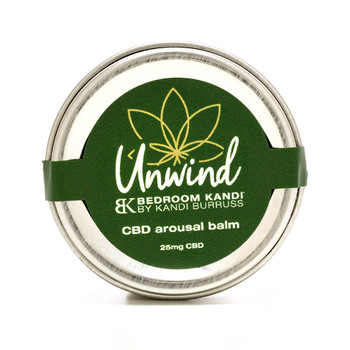 A small round silver tin of Unwind CBD-infused arousal balm with a green label on a white background