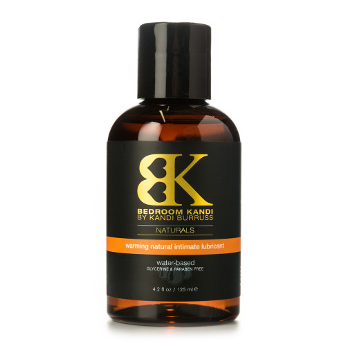 An image of a brown bottle with a black cap containing Bedroom Kandi's warming natural intimate lubricant.