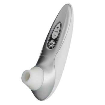 A side image of the Womanizer Pro40 massager. It is silver with a white suction head and black and white controls.