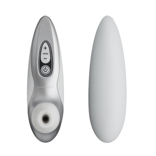 Front and back images of the Womanizer Pro40 massager, side by side. The massager is silver with a white suction head and black and white controls.