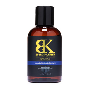 A bottle of Bedroom Kandi's Natural Essential Intimate Lubricant - a water-based lubricant in a brown bottle with a black cap on a white background
