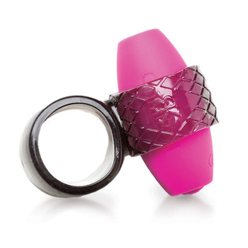 An image of our Rise and Shine massager on its side. To the left is an empty ring to attach to the penis. To the right the silicone ring is attached to a small pink removable bullet vibrator.