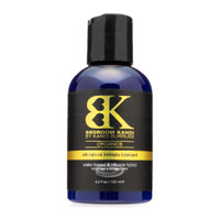 An image of Bedroom Kandi's SILK hybrid lubricant in a dark blue bottle with a black cap on a white background.